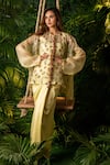 Buy_Pallavi Poddar_Yellow Organza Embroidery Thread And Pearls Round Garland Top & Draped Skirt Set _at_Aza_Fashions