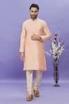 Buy_Arihant Rai Sinha_Peach Kurta Jacquard Banarasi Silk Pintucks Mandarin Collar Set _at_Aza_Fashions