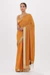 Buy_Nakul Sen_Orange Chiffon Embroidered Cutdana Plunge Neck Saree With Blouse _at_Aza_Fashions