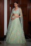 Shop Nadine Dhody Green Tulle Sequins, Beads, Cut Work Floral Art Embroidered Bridal Lehenga Set at Aza Fashions Shop_Nadine Dhody_Green Tulle Sequins, Beads, Cut Work Floral Art Embroidered Bridal Lehenga Set _at_Aza_Fashions