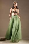 Buy_Nikita Mhaisalkar_Green Tulle Solid Flared Lehenga _at_Aza_Fashions