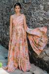 Buy_Redpine Designs_Peach Viscose Crepe Print Water Splash Floral Asymmetric Neck Jumpsuit _at_Aza_Fashions