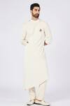 Buy S&N By Shantnu Nikhil Off White Cotton, Polyester Metallic Thread Draped Asymmetric Kurta at Aza Fashions Buy_S&N By Shantnu Nikhil_Off White Cotton, Polyester Metallic Thread Draped Asymmetric Kurta_at_Aza_Fashions
