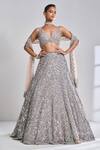 Buy_Seema Gujral_Beige Net Geometric Pattern Plunge V Neck Embroidered Bridal Lehenga Set_at_Aza_Fashions