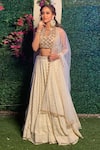 Buy_Aaryaa By Kashveen Kohli_Off White Georgette Hand Embroidered Thread Round Blouse Lehenga Set _at_Aza_Fashions