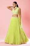 Buy_Quench A Thirst_Green Georgette Hand Embroidery Cutdana V Neck Pleated Lehenga And Blouse Set _at_Aza_Fashions