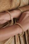 Shop_SMARS JEWELRY_Gold Plated Carved Geometric Stone Embellished Bangles - Set Of 4_at_Aza_Fashions