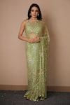 Buy_Astha Narang_Green Net Embroidered Nakshi Scoop Neck Sequin Saree With Blouse For Women_at_Aza_Fashions