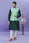 Buy_Aryavir Malhotra_Green Jacquard Banarasi Silk Floral Mandarin Collar Pattern Bundi _at_Aza_Fashions