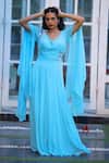 Buy_House of Tushaom_Blue Georgette Embroidery Sequin Leaf Neck Cape Sleeve Draped Gown _at_Aza_Fashions