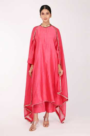 Off white hand block printed cotton chanderi short kalidar kurta set with all-over pink colored flower.
