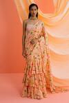 Buy Drishti & Zahabia Peach Silk Pearls, Sequins, Botanical Print Pre-draped Ruffle Saree With Blouse at Aza Fashions Buy_Drishti & Zahabia_Peach Silk Pearls, Sequins, Botanical Print Pre-draped Ruffle Saree With Blouse_at_Aza_Fashions