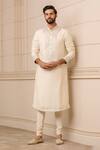 Buy_Tarun Tahiliani_Ivory Churidar  Stretch Poplin And Kurta  Spun Silk Embroidery Neckline Set _at_Aza_Fashions