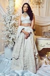 Buy_Varun Chakkilam_White Silk Organza Sequins, Beads, Embroidery V-neck Lotus Bridal Lehenga Set _at_Aza_Fashions
