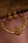 Shop_Zevar by Geeta_Gold Plated Stone Carved Temple Necklace Set _at_Aza_Fashions