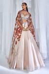 Buy Dolly J Ivory Organza Feathers, Embroidery Plunge Pixie Lehenga Set With Printed Cape at Aza Fashions Buy_Dolly J_Ivory Organza Feathers, Embroidery Plunge Pixie Lehenga Set With Printed Cape _at_Aza_Fashions