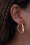 Shop_Anushka Jain Jewellery_Gold Plated Carved Lined Hoops _at_Aza_Fashions