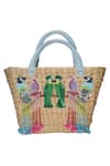 Buy_GINN AND TONIK_Beige Sequin And Beads Parrot Embellished Basket Woven Beach Bag _at_Aza_Fashions