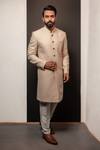 Buy_Darshika Menswear_Beige Silk Embroidery Textured Pattern Long Bandhgala Set_at_Aza_Fashions
