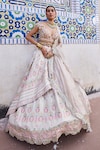 Buy_Aditi Gupta_Ivory Banarasi Chanderi Woven And Embroidered Vintage Layered Bridal Lehenga Set _at_Aza_Fashions