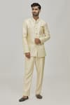 Buy_Khwaab by Sanjana Lakhani_Gold Floral Woven Bandhgala And Trouser Set_at_Aza_Fashions