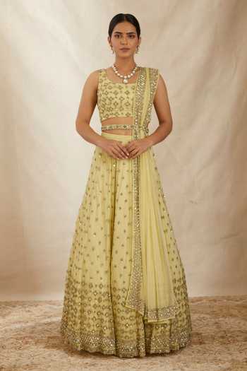 Buy_ASTHA NARANG_Yellow Net, Crepe, Nylon Embroidery, Cut Work, Flower Bridal Lehenga Set _at_Aza_Fashions
