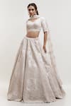 Buy_Kalighata_Ivory Silk Cut Work, Sequins V-neck Raw Embellished Bridal Lehenga Set _at_Aza_Fashions
