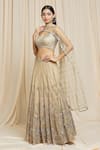 Shop Izzumi Mehta Beige Net Floral Plunge V Neck Hand Embroidered Lehenga Choli Set Online at Aza Fashions Shop_Izzumi Mehta_Beige Net Floral Plunge V Neck Hand Embroidered Lehenga Choli Set _Online_at_Aza_Fashions