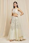 Izzumi Mehta_Ivory Net Embroidered Floral Round Hand Lehenga Choli Set _at_Aza_Fashions