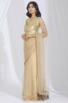 Buy_Manish Malhotra_Beige Net Embellished Saree_at_Aza_Fashions