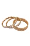 Shop_Moh-Maya By Disha Khatri_Gold Plated Stones Embellished Bangles Set Of 4 _Online_at_Aza_Fashions