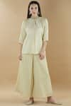 Buy_Nini Mishra_Beige Tissue Pintuck Flared Pants _at_Aza_Fashions