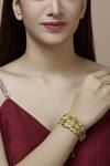 Buy_Mira By Radhika Jain_Gold Plated Metal Carved Bracelet_at_Aza_Fashions