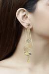Buy Mira By Radhika Jain Gold Plated Metal Carved Long Earrings at Aza Fashions Buy_Mira By Radhika Jain_Gold Plated Metal Carved Long Earrings_at_Aza_Fashions