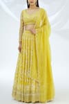 Buy_Astha Narang_Yellow Net, Crepe Leaf Neck Embroidered Lehenga Set _at_Aza_Fashions