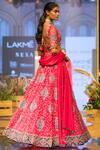 Shop_Ridhi Mehra_Red Raw Silk V-shaped Neckline Embroidered Bridal Lehenga Set _at_Aza_Fashions