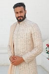 Vanshik_Peach Raw Silk Embroidered Sherwani And Kurta Set _Online_at_Aza_Fashions