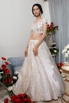 Asha Gautam_White Banarasi Zari Organza V Neck Lehenga Set _Online_at_Aza_Fashions