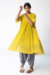 Buy Urvashi Kaur Yellow Cotton Round Neck Check Micro Pleated Dress at Aza Fashions Buy_Urvashi Kaur_Yellow Cotton Round Neck Check Micro Pleated Dress _at_Aza_Fashions