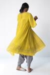 Shop Urvashi Kaur Yellow Cotton Round Neck Check Micro Pleated Dress at Aza Fashions Shop_Urvashi Kaur_Yellow Cotton Round Neck Check Micro Pleated Dress _at_Aza_Fashions
