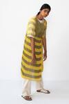 Shop Urvashi Kaur Yellow Handloom Cotton Round Neck Striped Micro Pleat Wrap Dress at Aza Fashions Shop_Urvashi Kaur_Yellow Handloom Cotton Round Neck Striped Micro Pleat Wrap Dress _at_Aza_Fashions