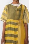 Shop Urvashi Kaur Yellow Handloom Cotton Round Neck Striped Micro Pleat Wrap Dress Online at Aza Fashions Shop_Urvashi Kaur_Yellow Handloom Cotton Round Neck Striped Micro Pleat Wrap Dress _Online_at_Aza_Fashions