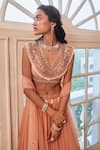 Buy Label Sanya Gulati Peach V Neck Embroidered Blouse And Lehenga Set Online at Aza Fashions Buy_Label Sanya Gulati_Peach V Neck Embroidered Blouse And Lehenga Set _Online_at_Aza_Fashions
