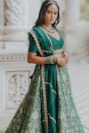 Anjana Bohra_Green Raw Silk, Organza, Banarasi Zari Work V Neck Floral Lehenga Set_at_Aza_Fashions