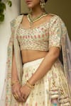 Shop Angad Singh White Dupattas- Net, Lehenga And Blouse- Raw Silk Floral V Embroidered Bridal Set at Aza Fashions Shop_Angad Singh_White Dupattas- Net, Lehenga And Blouse- Raw Silk Floral V Embroidered Bridal Set _at_Aza_Fashions