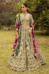 Shop_Angad Singh_Green Lehenga And Blouse- Raw Silk Embroidered Floral V Neck Bridal Set_at_Aza_Fashions