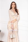 Sakshi Girri_Beige Crepe Printed Floral Motifs V Neck Kurta And Sharara Set _Online_at_Aza_Fashions