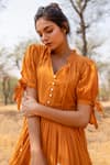 Buy_Myaara_Orange Mul Plain V Neck Tie Up Sleeve Flared Dress _Online_at_Aza_Fashions