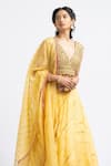 Shop_Nitika Gujral_Yellow Organza Embroidered Bead V Neck Lehenga Set _Online_at_Aza_Fashions