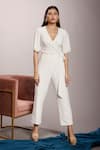 Buy_Couché By Anandini_White Punto Plain V Neck Front Tie-up Jumpsuit _at_Aza_Fashions